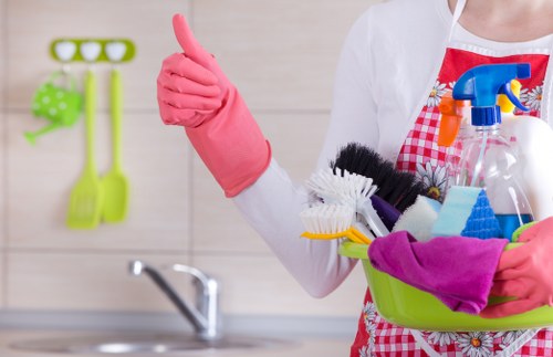 Worker handling carpet cleaning equipment with care