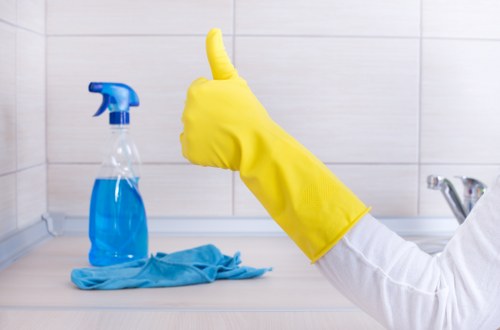 Carpet cleaning technician preparing equipment with safety focus