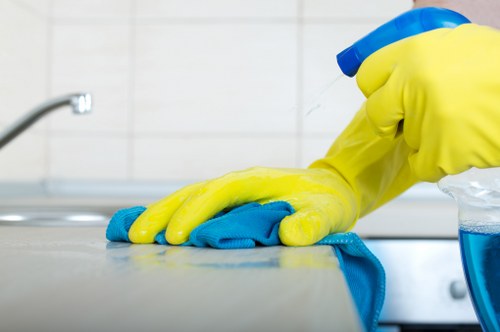 Technician checking cleaning products and safety measures